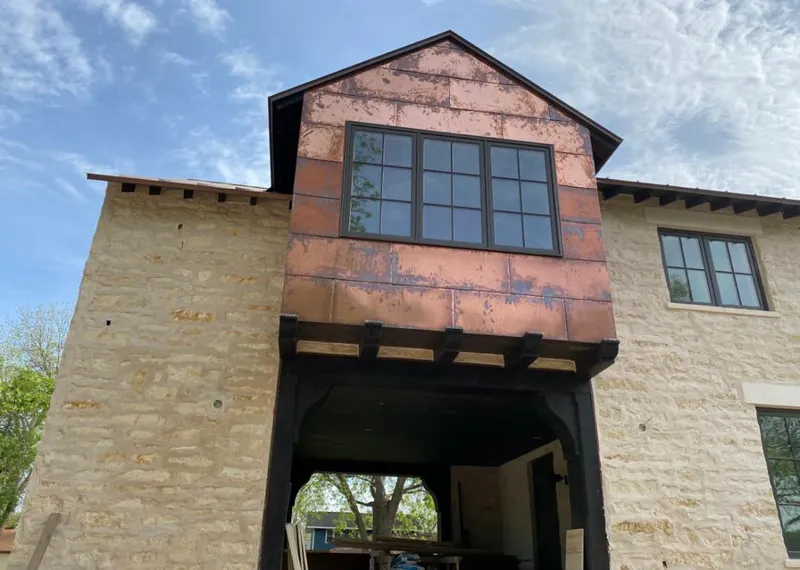 Copper metal panel facade on a stone building for Skylight Installation in Kennewick